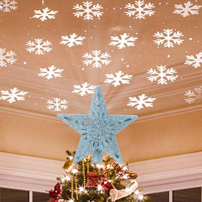 China Christmas Tree Topper Lighted Star Tree Toppers with LED Rotating Snowflake Projector Lights 3D Hollow Silver Star Snow Tree Top for sale