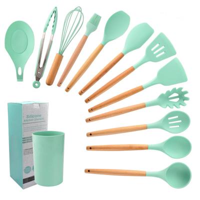 China Viable Heat Resistant Cookware Set With Creative Kitchen Tool Kit Silicone Cooking Tableware With Wooden Handle for sale