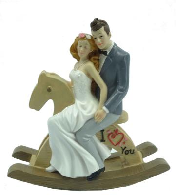 China Happy Newlyweds Table Decoration Couple on Rocking Horse Resin Wedding Table Decoration for sale