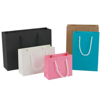 China Recyclable Custom Logo Paper Gift Bag Shopping Bag For Clothes for sale