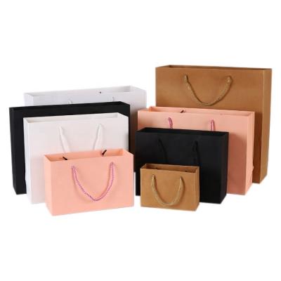 China Recyclable White Card Paper Bag Custom Cosmetics Packaging Bag Shopping Clothing Bag for sale