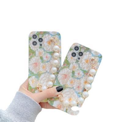 China Luxury Flower Phone Case For iPhone 11 12 pro 7 8 max plus X Back Cover Pearl Chain Wrist Strap Coque HZ-212105373 for sale