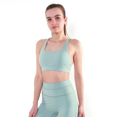 China 2022 New 20% Back Breathable Spandex Hollow Bar Design Breathable 80% Sports Nylon Vest Can Be Customized Size Yoga Bra for sale