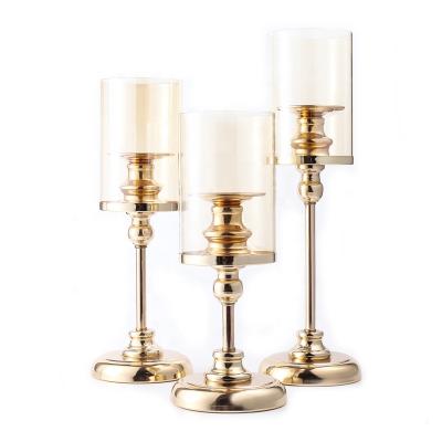 China Retro Weddings 3pcs Set Elegant Gold Metal Wind Proof Candle Holder Candlestick For Wedding Party Table Centerpieces Home Decoration for sale