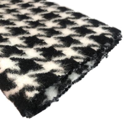 China Viable newcomer classic black white wool yarn dyed houndstooth woven woolen fabric for suit coat for sale