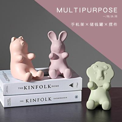 China Art Deco Nordic Creative Cute Ceramic Animal Mobile Phone Holder Piggy Bank Home Decoration Wholesale for sale