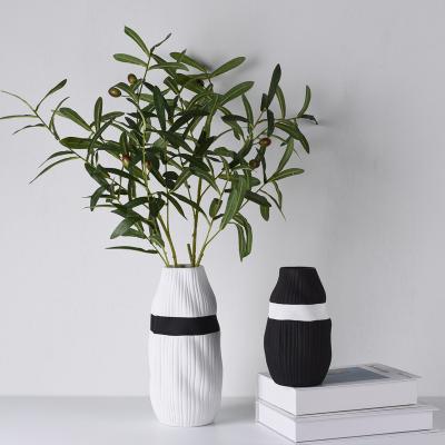 China Hotel Creative Irregular Ceramic Vase Art Deco Nordic Vase Table Top Black And White Oval Flower Vases for sale