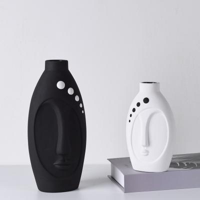 China Modern Nordic Ceramic Vases Vase Art Deco Creative Black White Face Faced Ceramic Flower Vase For Home Decoration for sale