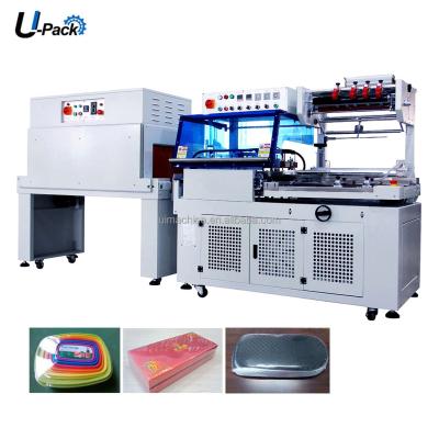 China Food Automatic L Type Wrapping Shrink Sealing Machine For Cans L Bar Sealing Cutting Shrinking Machine For Trays for sale