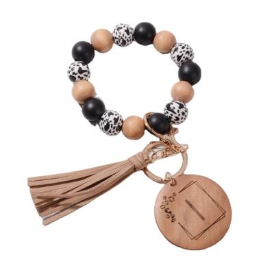 China Fashion Promotion Bead Bracelet Key Ring Alphabet Board Tassel Key Chain Wooden Wooden Key Chain Bracelet for sale