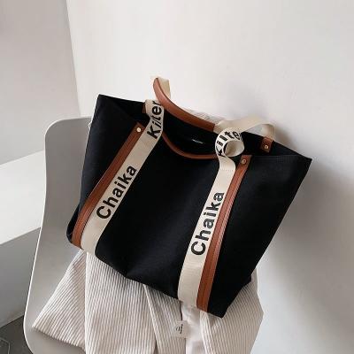 China Lady Strong Transparent Carrier Shoulder Handles Creative PP Women Beach Bag With Logo Printing for sale