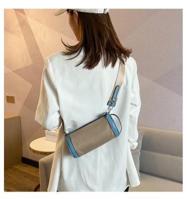 China Lady Vegan Colors Duffel Bag Women Stitching Cylinder Shoulder Bag Mini Small Multi Strap Leather Strap for sale