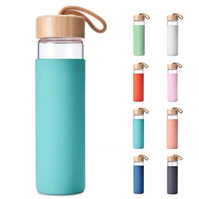 China 2022 New Design Borosilicate Glass High Quality Colored Water Bottle Viable With Silicon Sleeve PU Strap for sale