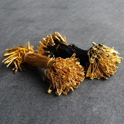 China Viable Black Or Gold Color End Hang Tag Strings Seal Gold Pin With Nylon And Stopper for sale