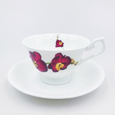 China Viable British Afternoon Tea Cup Set Pure White Bone China Embossed Flower Shaped Coffee Cup And Saucer for sale