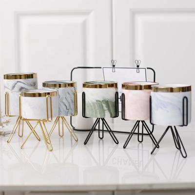 China Wholesale Modern Nordic Customizable Price Unique Decorative Marble Decorative Cylinder Candle Ceramic Luxury Jars With Iron Holder for sale