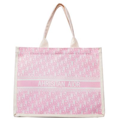 China 2022 New Large Shoulder Fashion Tote Retro Bag Fashionable Alphabet Portable Printed Shopping Bag Canvas Bag for sale