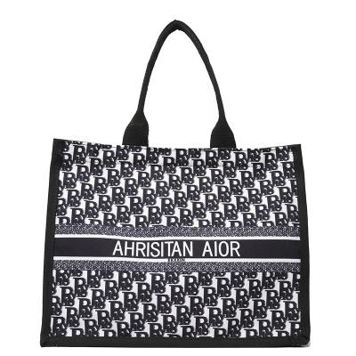 China 2022 new fashion large tote bag fashionable alphabet retro shopping bag portable printed canvas bag for sale