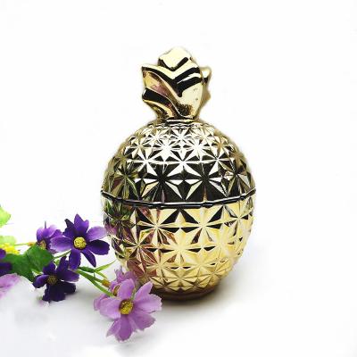 China Fashionable Custom Glass Candle Jars Gold Cookie Jar Pineapple Jars Candles With Glass Lid for sale