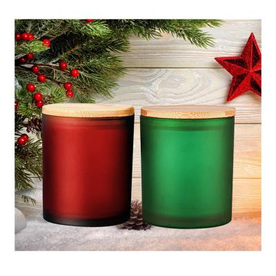 China Home Decor Matte Black Amber Frosted Heat Resistant Green Glass Candle Jar With Woodland Lids for sale