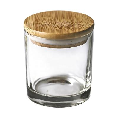 China Who respects the environment. Wholesale Hot Sale Empty Clear/Transparent Candle Stocked Jars With Lid Wooden Candle Holders Glass Jar For Candle Making for sale