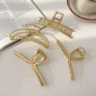 China Newest Design Low MOQ Metal Hair Claw Clip Women Large Gold Girls Hair Clip Shark Claw Clip Alloy Cross Geometric Hollow Metal for sale