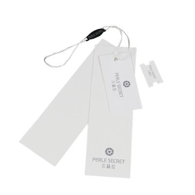 China Garment Accessories Recyclable Luxury Paper Labels Custom Embossed Embossed Label With Your Own Logo for sale