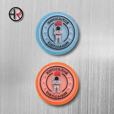 China Washable Promotional Iron On Logo Embossed Silicone Patches PVC Rubber Labels 3d Garment Silicon Label For Clothing for sale