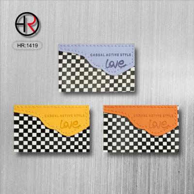 China Washable fashion garment decoration label factory price label button and grid combination cheap leather labels for clothing for sale