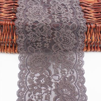 China 1.2-5.5CM Elastic Flower Pattern Fabric Trim Jacquard Flat Lace Up Bridal Lace Trim for sale