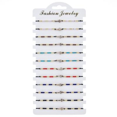 China 12pcs/card Pure Handmade BOHEMIA Classic Fashion Seed Bead Alloy Adjustable Woven Cross Bracelet for sale