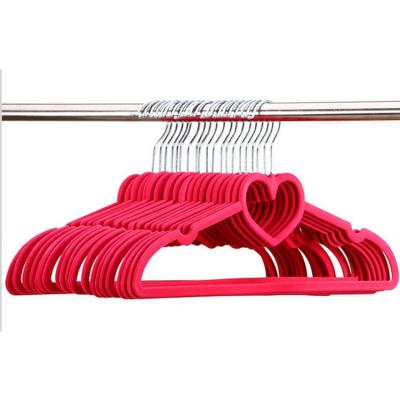 China Multifunctional high quality flocking plastic hanger design pink non slip heart clothing 10 packs for sale