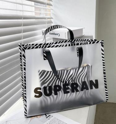 China 2022 New Eco-friendly Simple Portable Transparent Large Fashionable Korean Version Shoulder Bag Tote Bag Letter Soft Bag for sale