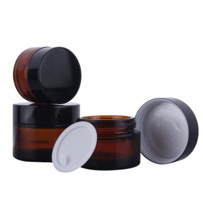 China Cosmetic Cream Jar Glass Skin Care Cosmetic Packaging With Black Lid for sale