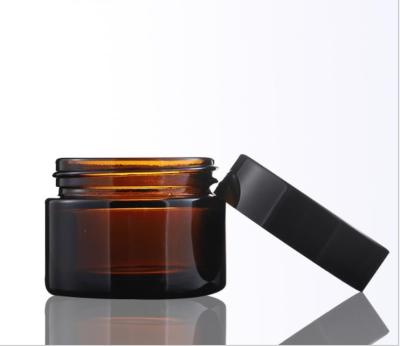 China 100g Cosmetic Glass Cream Jar Skin Care Packing Glass Jar With Black Gold Aluminum Metal Lids for sale