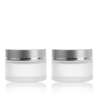 China Wholesale Empty Frosted Clear Glass Cosmetic Jar Skin Care Cream Container With Matte Silver Luster Silver Cap for sale