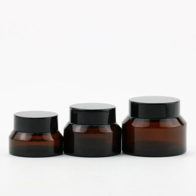 China Recyclable Customized Round 30g 50g 2oz 4oz 8oz Amber Glass Jars Cosmetic Cream Container for sale