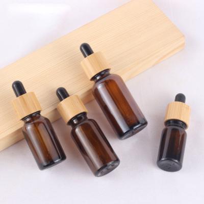 China Personal Care 30ml Bamboo Essential Oil Bottle Matte Black Red Amber Frosted Cap Glass Dropper Bottle for sale