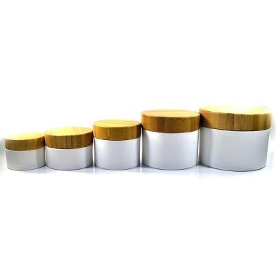 China Skin care creams wholesale empty pp plastic cosmetic cream frosted plastic jar container10g 20g 30g 50g 100g 150g 200g 250g pp with bamboo lid for sale