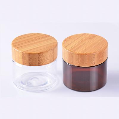 China Eco-friendly Material 50ml 150ml 8oz 250ml 500ml Frosted Light Green Amber Black Cosmetic PET Plastic Jar With Bamboos Screw On Lid for sale