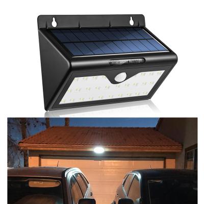 China ABS+PC Solar Wall Light 28 LED Lights Outdoor Security Lighting with Motion Sensor Detector for Garden Back Door Step Stair Deck Fence for sale