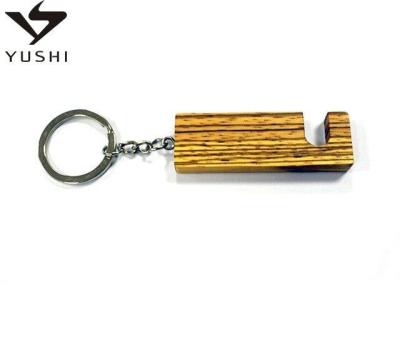 China 2020 Wholesale New China Functional Wooden Key Chain Phone Holder/Prop Wooden Key Rings For Gift for sale