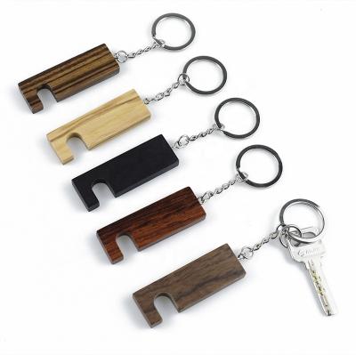 China 2021 New China Wholesale Functional Wooden Key Chain Phone Stand / Custom Logo Prop Key Ring for sale