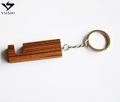 China 2021 Hot China Design Key Chain Phone Holder Stand / Prop Wooden Keychain Custom Logo for sale