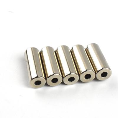 China Industrial ndfeb disc cylinder magnet strong power diametrical magnetized magnets with hole for sale