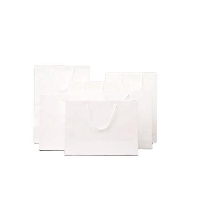 China Recycled Materials Customize Wholesale High Quality Stock Shopping Bag White Paper Bags With Handles For Gift Shopping Packaging for sale