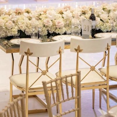 China Modern New Design Golden Stainless Steel Frame And White Pu Wedding Cross Back Dining Chair for sale