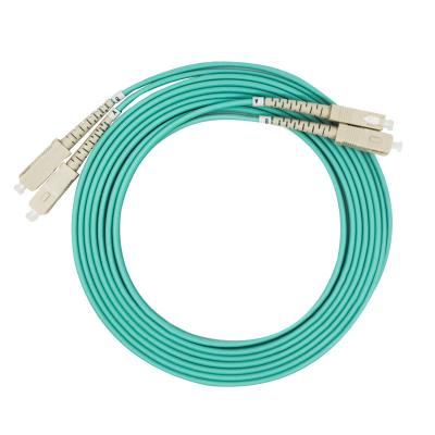 中国 FTTX systems SC/pc SC/pc 10g jumper patchcord om3 multimode aqua 販売のため