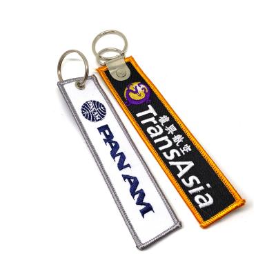 China Clothes Fast Delivery Custom Fabric Embroidery Letter Key Chain For Promotional Gift for sale