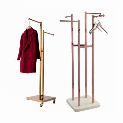 China Clothes Shop 4am Floor Standing Heavy Type Special Shape Clothing Display Rack With Furniture Feet for sale